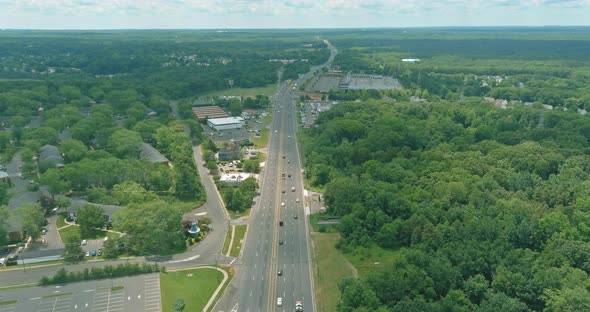 Aerial View Highway Transportation with Cars and Truck Rushing Along a Highspeed Freeway alt