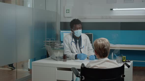 Invalid Elder Patient Having Appointment with Doctor alt