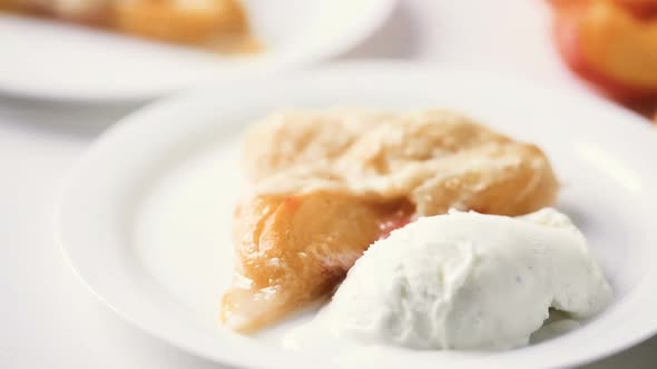 Slice of home made peach galette with lcoal peaches. alt