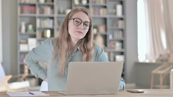 Portrait of Tired Woman Having Back Pain in Office alt