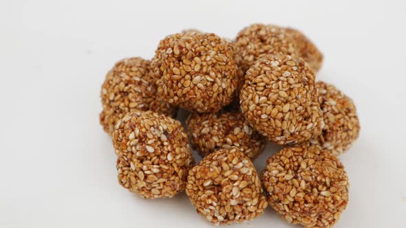 Rotating view of sesame seeds ladoo, View of sweets made from Sesame seeds alt