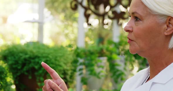 Female scientist counting plants alt