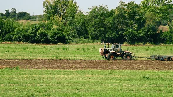 Farm Tractor On Field