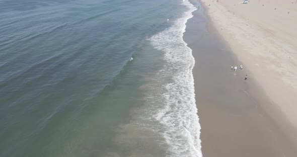 Pacific Ocean seen above as a drone coasts along towards Malibu alt
