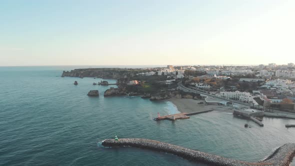Fort Ponta da Bandeira protecting the Bensafrim River's quay. Panoramic aerial of Lagos, Algarve alt