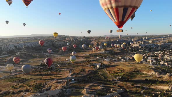 Aerial Hot Air Balloons Flying Over Hoodoos and Fairy Chimneys in Goreme Valley Cappadocia, Turkey alt