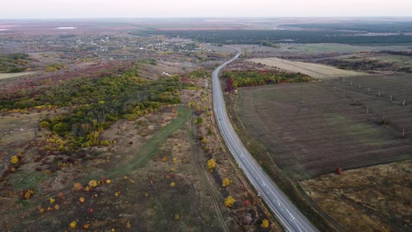 Highway on the Background of Wind Turbines and Blue Sky alt