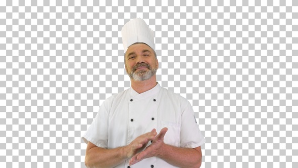 Senior chef applauding to camera and smiling, Alpha Channel alt