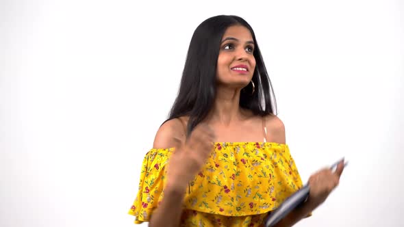 Super excited college Indian girl smiling and talking alt