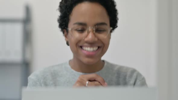 African Woman Doing Video Chat on Laptop alt