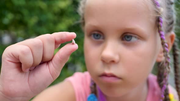 Cute Little Girl with First Milk Temporary Tooth