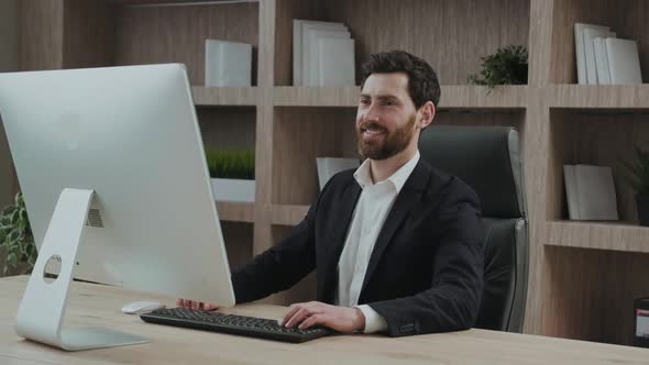 Calm and Relaxed Office Worker Satisfied with the Results and Feels Relieved in His Office Chair alt