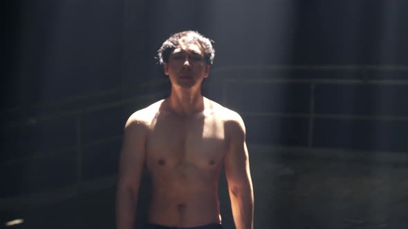 4K Portrait of Asian man bodybuilder do sport training workout exercise in abandoned building. alt