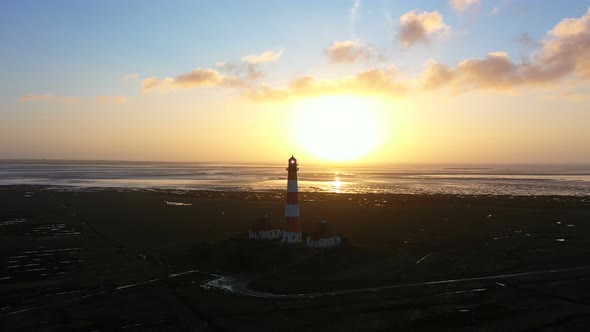 Lighthouse at Sunset, Aerial View, Moving Away