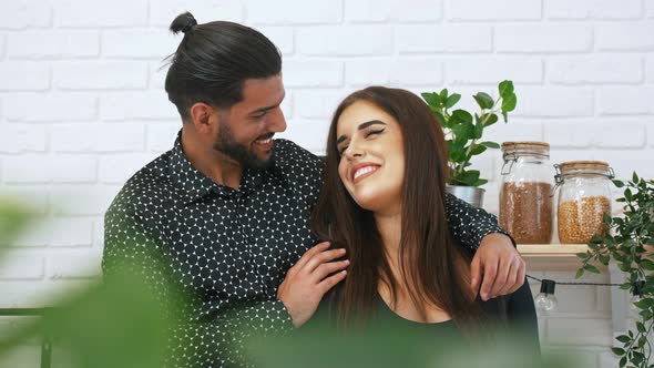 Beautiful Brunette Young Woman Looking at Her Cuban Attractive Husband alt