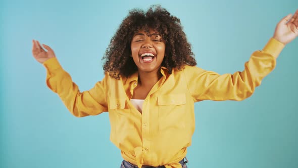 Young Afro American Female Jumping Up Appearing From the Bottom of Screen and Laughing Posing on alt