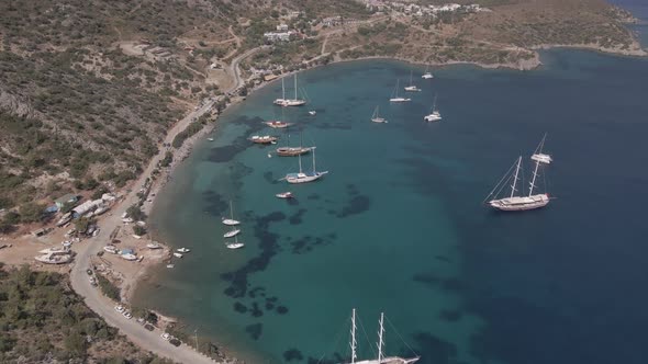 aerial view of a beautiful beach and boats. swimming people aerial. alt
