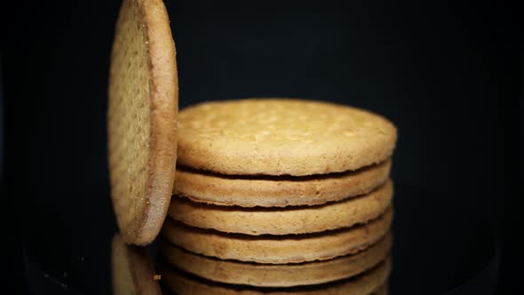 Stack Of Digestive Biscuits Isolated On Black Background. - rotating shot, macro alt
