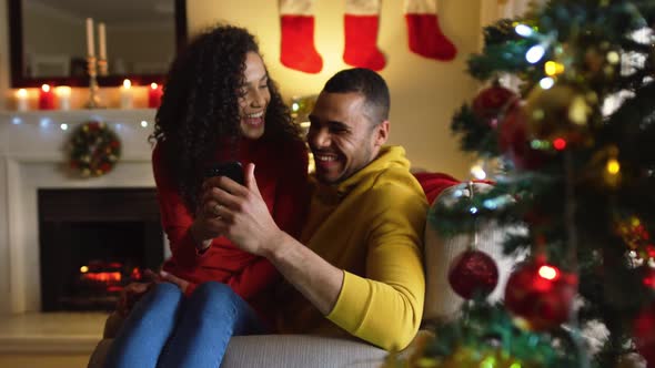 Couple at home at Christmas time alt