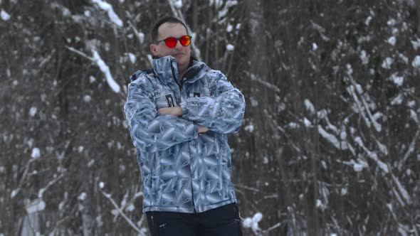Man Stands Alone Against White Snowstorm and Snow Storm a Snowfall alt