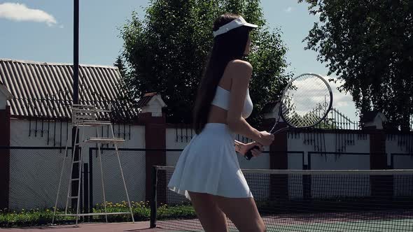 Crop Woman Playing Tennis on Court alt