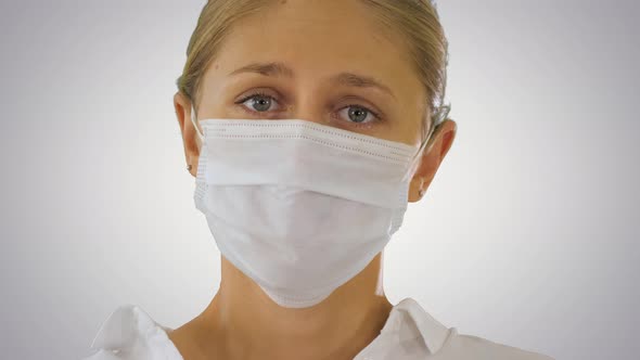 Business Woman in a Protective Medical Mask on Gradient Background alt