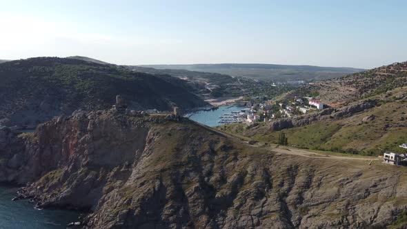 Video From a Drone of a Sea Bay Mountains and a Town on the Shore of the Bay