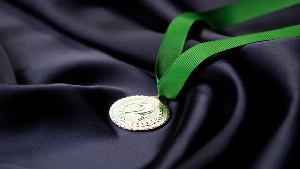Silver Medal with Ribbon on Black Background Closeup alt