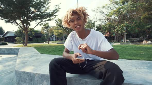 Skateboard Listening Music With Smartphone