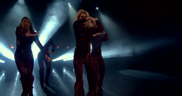 Sexy Women Dance on Stage Under the Spotlights alt