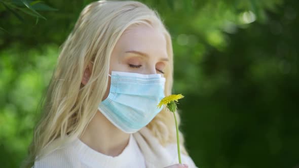 A Young Woman Cannot Smell Flowers Without a Mask Due to Her Allergy to the Bloom alt