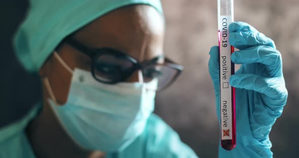 Doctor hands holding a coronavirus COVID-19 negative test tube