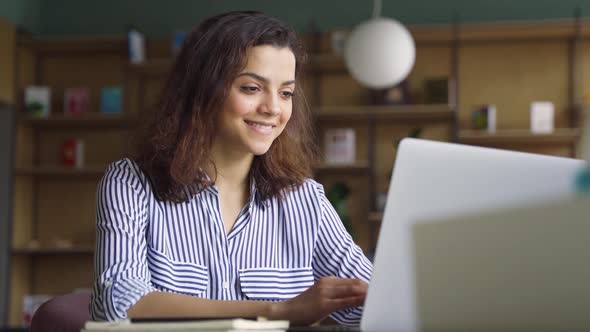 Happy Latin Girl Student Using Laptop Watching Distance Online Seminar Class alt