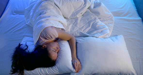 Adult Brunette Woman Is Tossing in Bed at Night By Nightmares, Bad Sleep and Insomnia alt