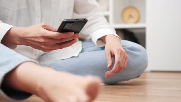 Girl Write A Message On Smartphone Sending Online Messages. Hold The Phone In Your Hands alt