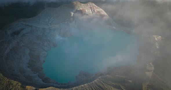 Panoramic view at East Java, Indonesia. Aerial view of rock cliff at Kawah Ijen volcano with turquoi alt