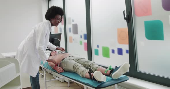 Portrait Of Attractive Positive AfroAmerican Woman Doctor Looking At Camera alt