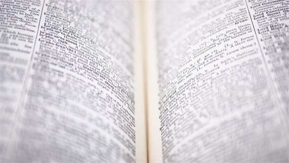 4K - Camera moves above the dictionary. Close-up alt