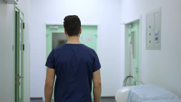 Live Camera Follows Professional Surgeon Walking to Operating Room in Slow Motion alt