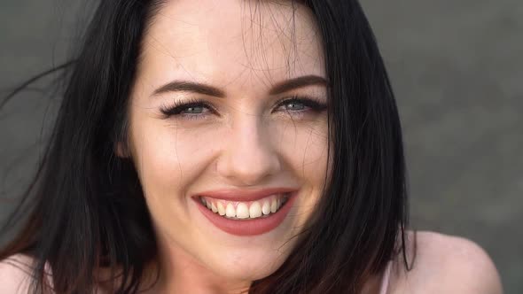 Portrait of Young Attractive Girls Smiling and Looking at Camera. Slow Motion alt