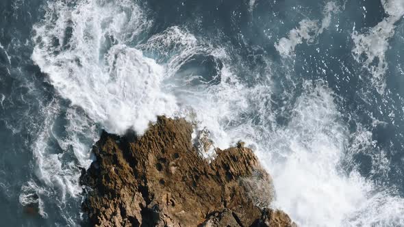 Ocean Waves Hit the Rock Rotating Topshot Aerial View in Portugal