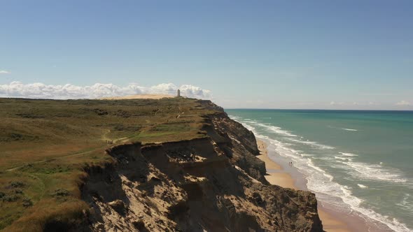 Drone Over Landscape Towards Rubjerg Knude Lighthouse alt