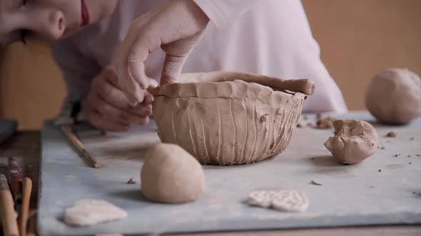 Little Kid Girl Making Ceramic Object in Workshop Studio