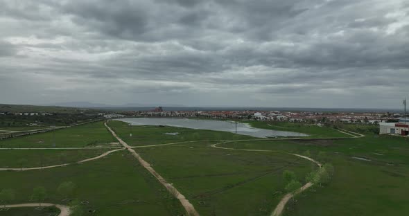 Stunning shoot of a village and its pond alt
