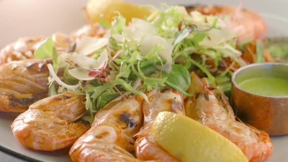 Grilled tiger shrimps with asparagus and lemon