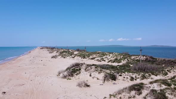 A long sandy spit with a beautiful azure sea