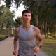 Athletic Man with Muscular Body Running in the Evening Outdoor Facing Sundown Motivation - VideoHive Item for Sale