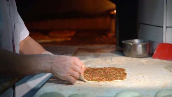 Baker Making Turkish Pizza