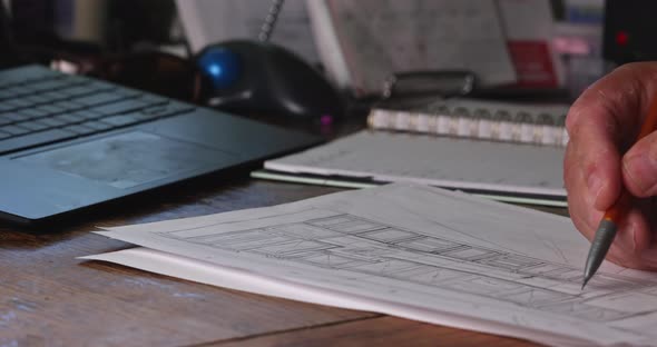 Construction Equipment on Engineer a Male Hands Sketching with Custom Kitchen alt