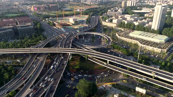 Aerial view of highway and overpass in city alt